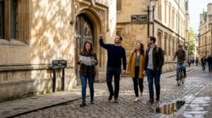 Adults walking historic Oxford street on tour