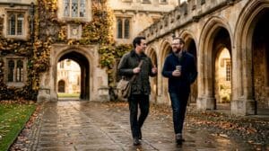Alumni walking and talking in Oxford quad