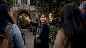 Professional guide explaining to tourists outdoors