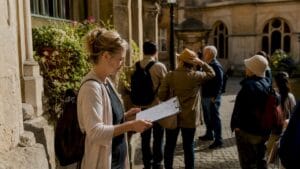 Tour guide planning group walking tour outdoors