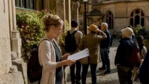 Tour guide planning group walking tour outdoors
