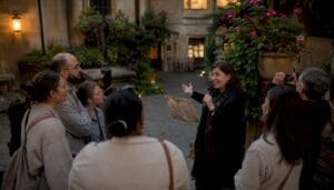 Tour guide interacting with visitors outdoors